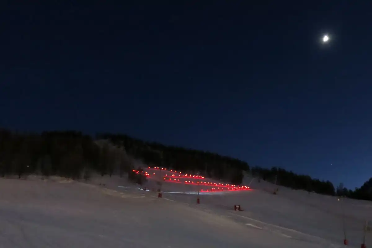 Skiing in Montgenevre: Torch-lit Descent
