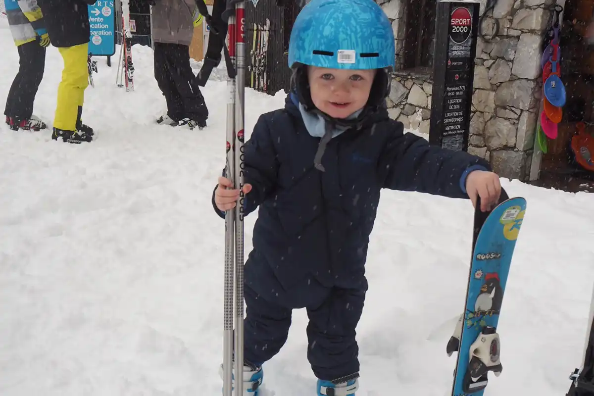 Family skiing in Valmorel: Collecting the skis, boots, helmet and poles