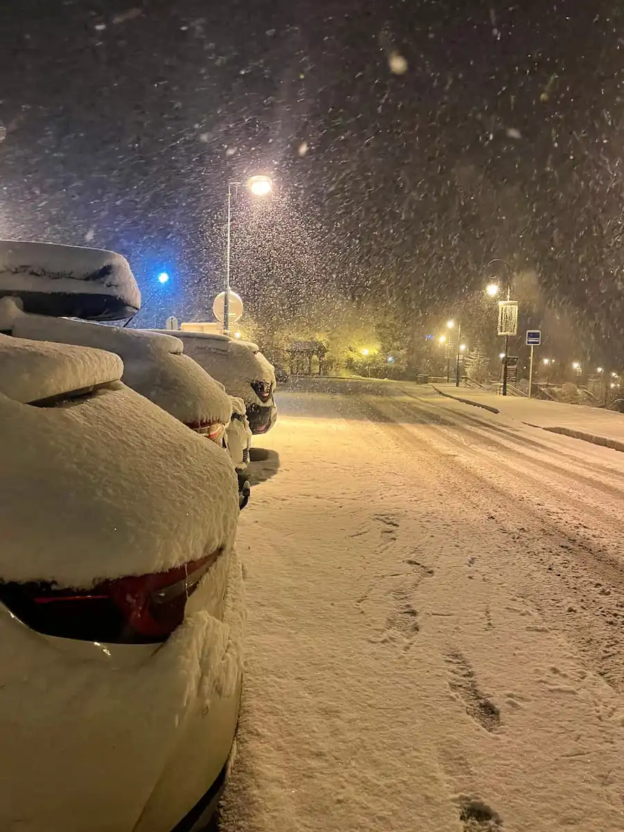 Fresh Snow Falling On Cars In Val Cenis In March